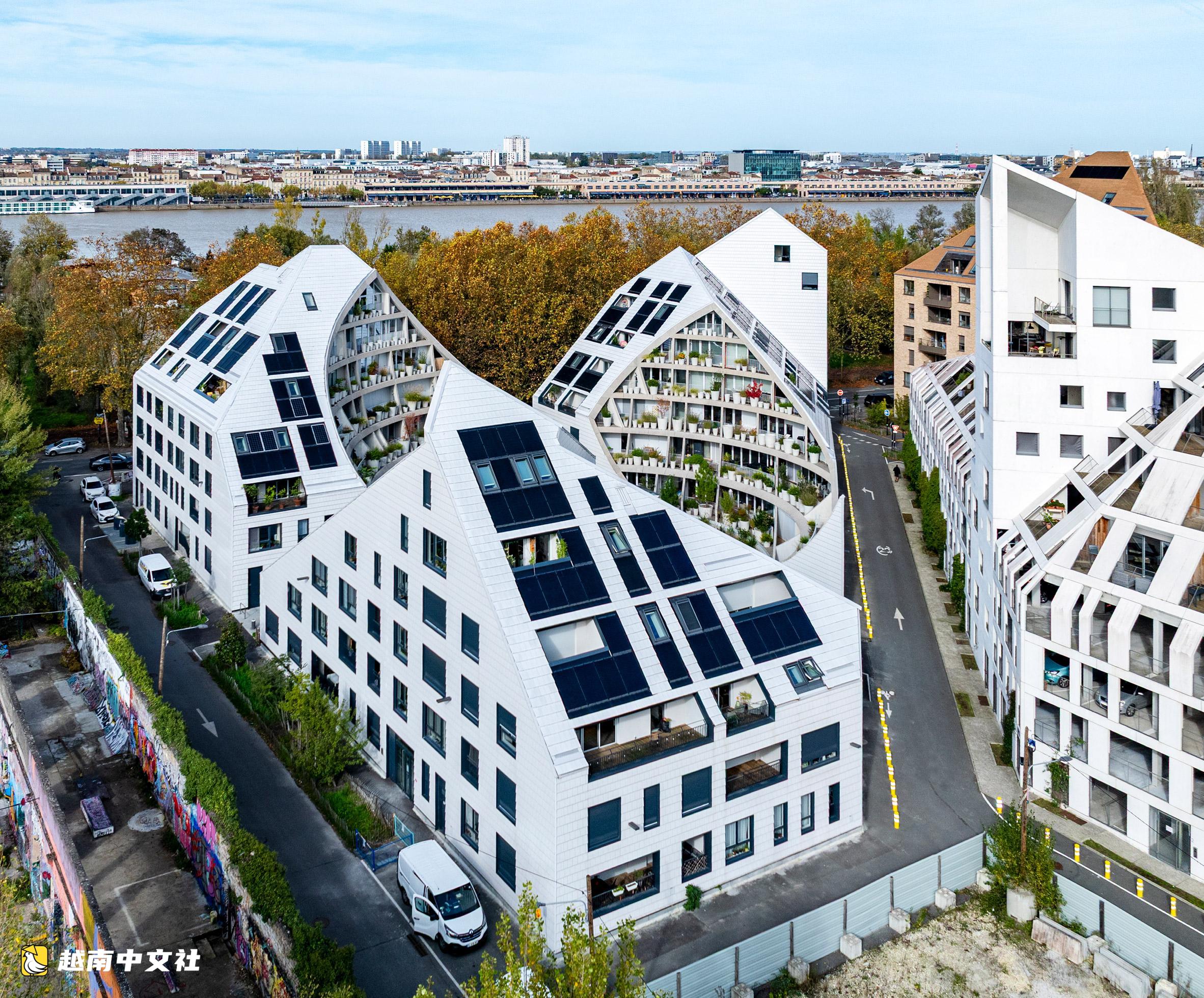 越南:花盆和人物拱門讓舊工業區住宅區充滿生機