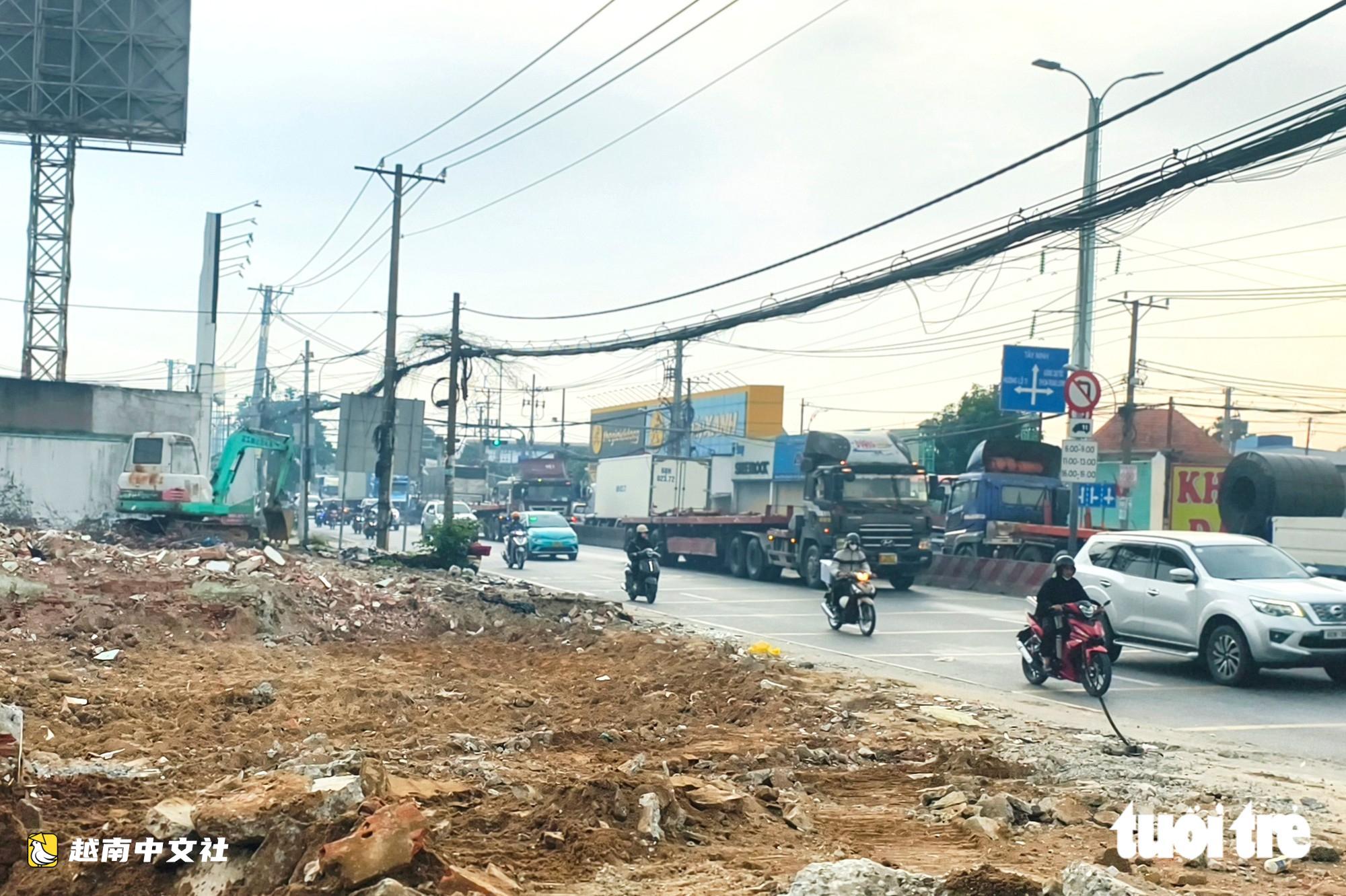 胡志明市1號國道擴建項目交地,拆除和收購“舊房”行業一片繁忙