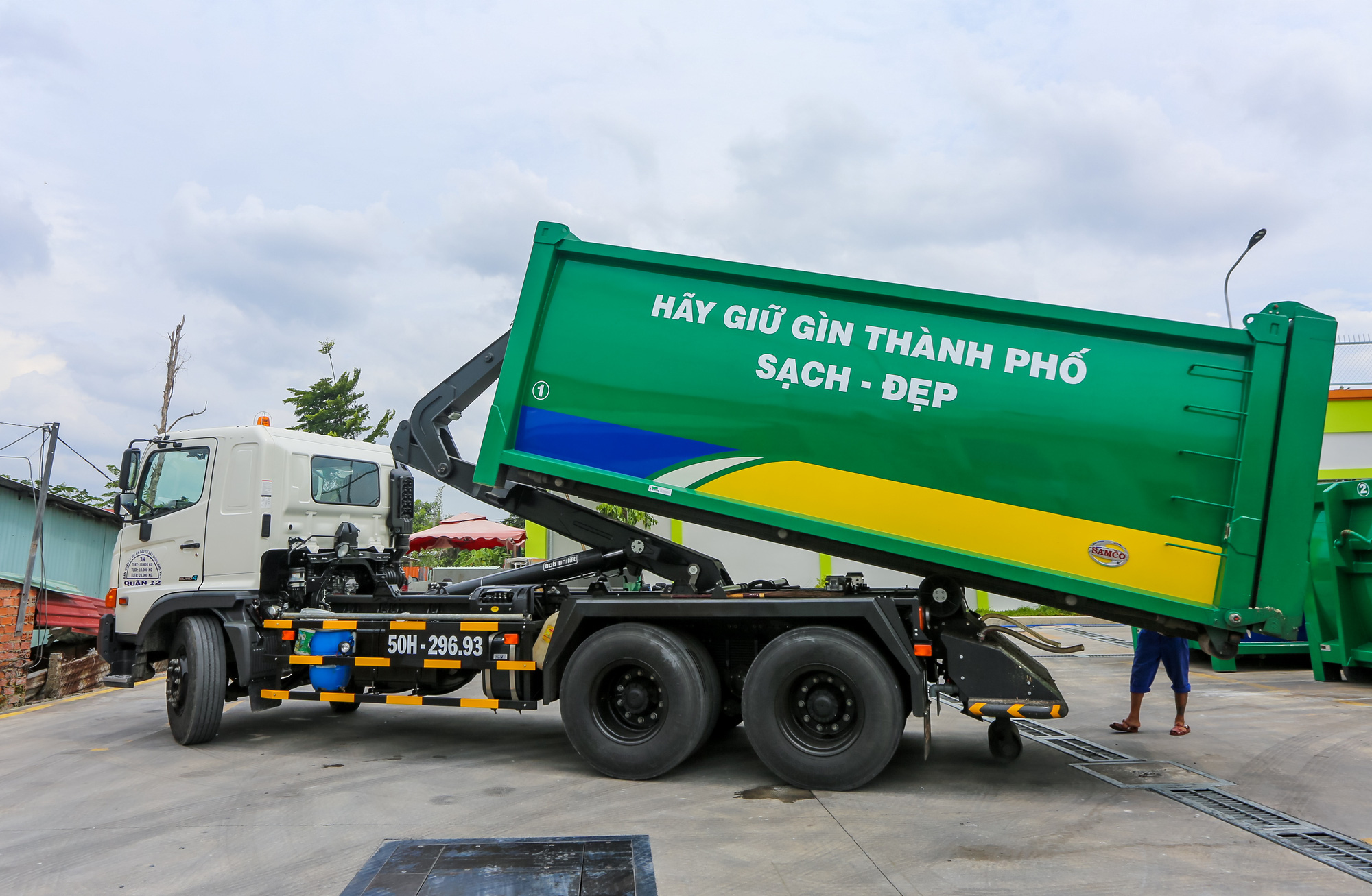 合并后，胡志明市的垃圾费有何变化？