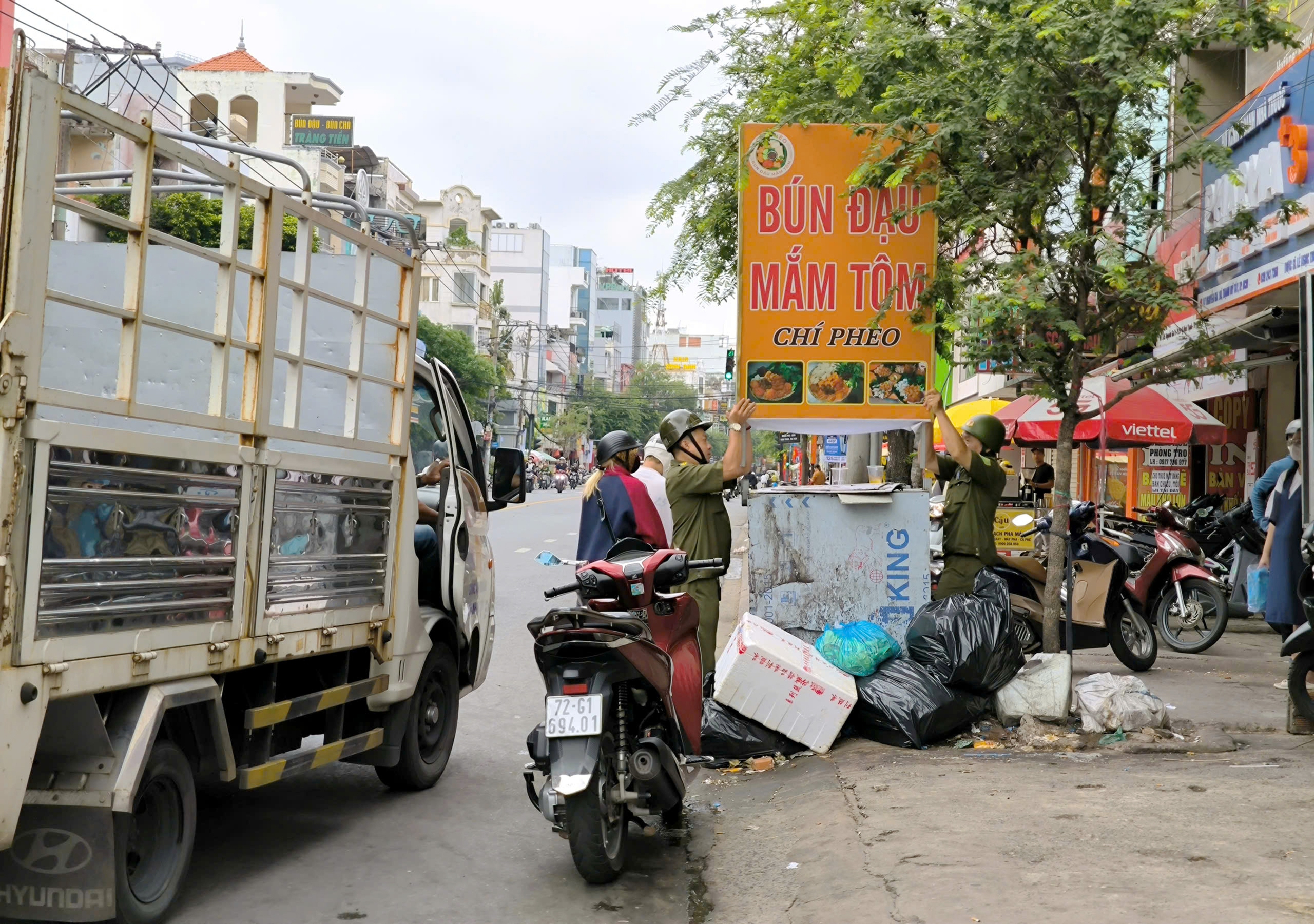 处理侵占人行道，不要‘抓了又放’